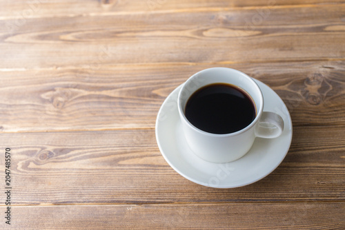 Coffee Cup on Wooden Table with Copy Space