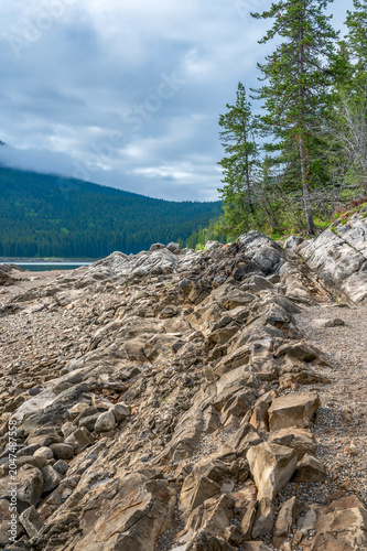 Rocky shore of Lake Minnewanka in Banff National Park, Alberta, Canada