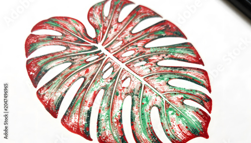 Artistic close-up of a tropical monstera leaf painted with vibrant red, green, white, and black brushstrokes. Contemporary botanical artwork featuring abstract textures, splatter effects, and expressi