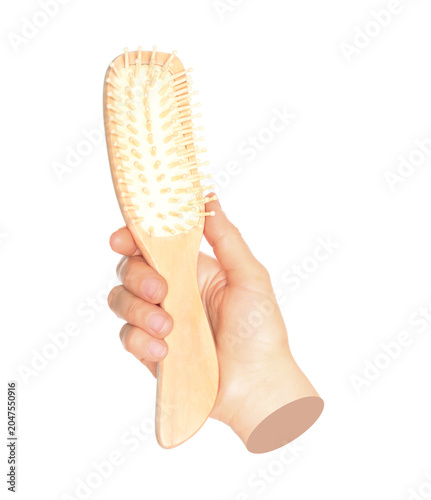 Valokuva Woman hand holds hairs comb, isolated on transparent background, visage concept