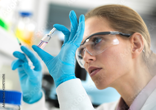 Pharmaceutical Research, Scientist preparing a new drug for testing in the laboratory