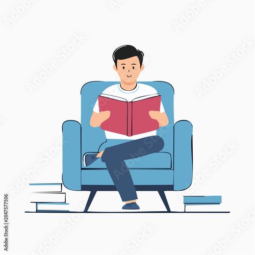 Man Reading a Book While Sitting on a Comfortable Armchair