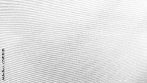 Close-up of white fabric texture with diagonal pattern background.