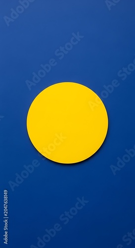 Vibrant Yellow Circle Centered on Deep Blue Background, Minimalist Abstract Design.
