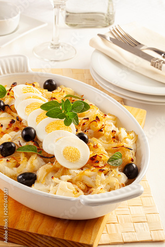 Cod with onions and boiled egg, Portuguese style.