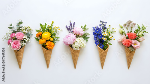 Sweet Summertime Blooms: A delightful display of five waffle ice cream cones, each artfully filled with a vibrant and unique floral arrangement, evoking a sense of joy and freshness.