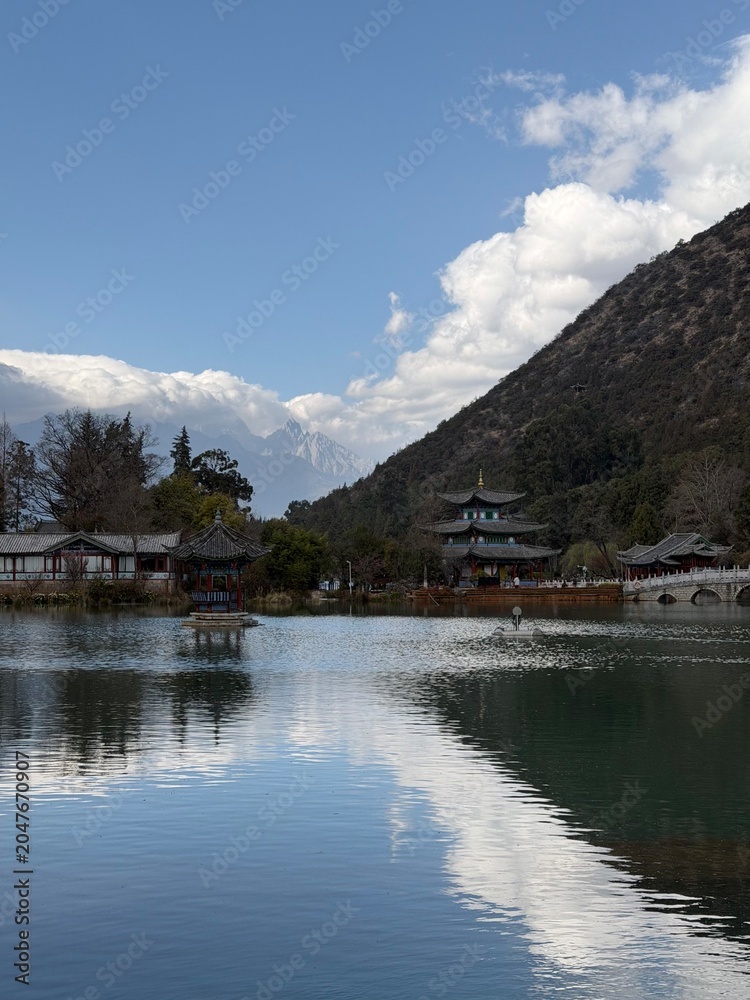 Fototapeta premium Traditional pavilion reflecting in Black Dragon Pool