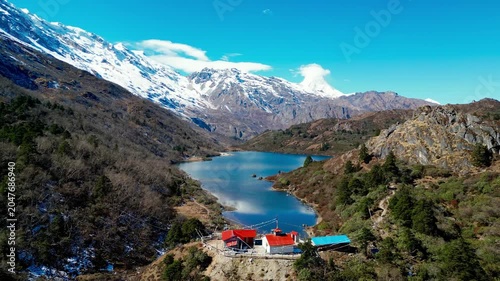 Aerial Flight Over Kaltal Lake with Manaslu Mountain in the Nepal Himalayas