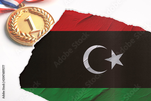 Foto Golden First Place Medal with Patriotic Ribbon Partially Revealing the Libyan Fl