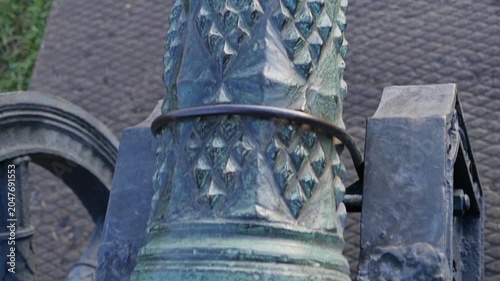 Medieval bronze cannon with richly decorated elements, sequence
