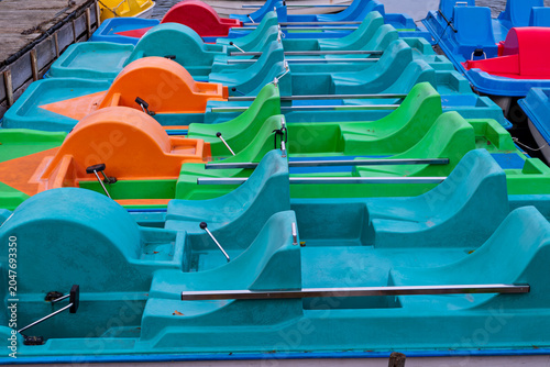 Colorful pedal boats at the pier