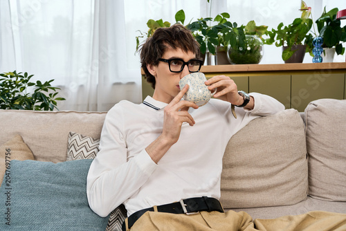 Bild auf Leinwand A young gender nonconforming person enjoys a moment of tranquility at home with