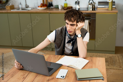 Bild auf Leinwand Young gender nonconforming person finds peace while working at home