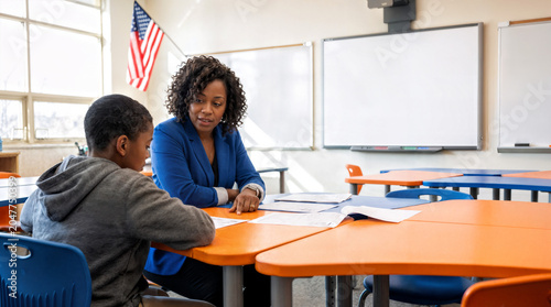 Teacher Assisting Student During Individual Learning Session