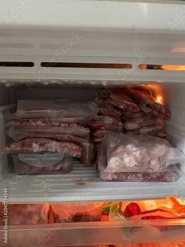 Meal prep. Food preparation. Sliced meat. Raw meat. Home cooking. Cooking ingredients. Kitchen preparation. Protein food. Fresh meat. Homemade food. Food storage. Food container. Refrigerator storage.