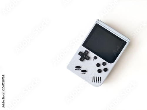 Fotografía Retro handheld gaming console on a white background.