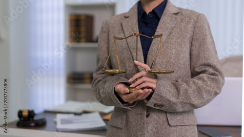 Quadro su tela professional lawyer holding brass scales of justice representing legal ethics fa