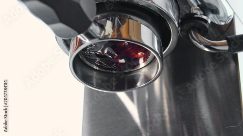 Brewing coffee in an espresso machine, bottomless portafilter