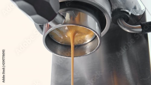 Brewing coffee in an espresso machine, bottomless portafilter