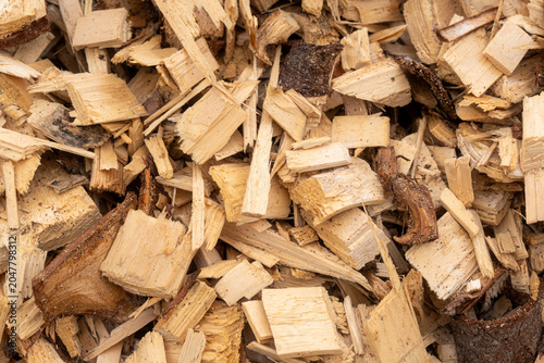 Wood chips close up, biomass fuel texture for heating season and renewable energy