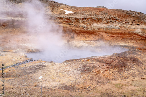 Rising steam from a geothermal pool in Iceland