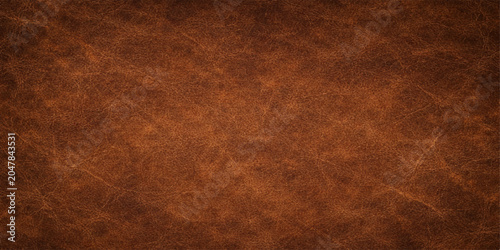 An antique brown leather texture background with a grungy, aged pattern reminiscent of old vintage parchment or a rough textured surface