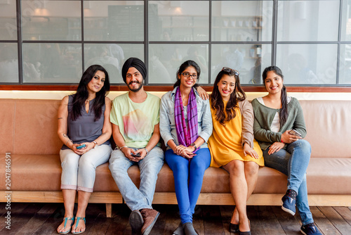 Photography Diverse group sitting smiling together