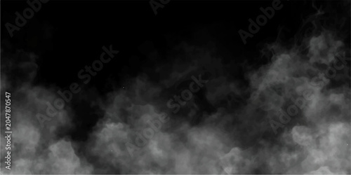 Obraz na plátně Ethereal white smoke or fog drifts low across a stark black background, creating an atmospheric and mysterious visual effect
