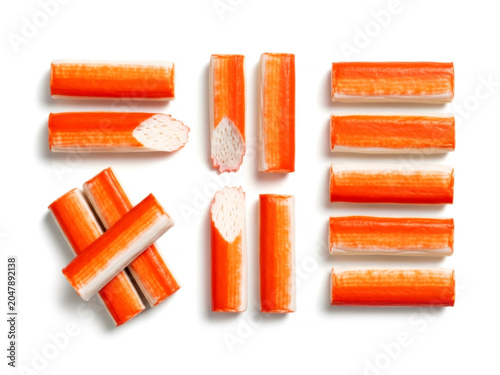 Processed red and white crab sticks surimi seafood snack isolated on white background