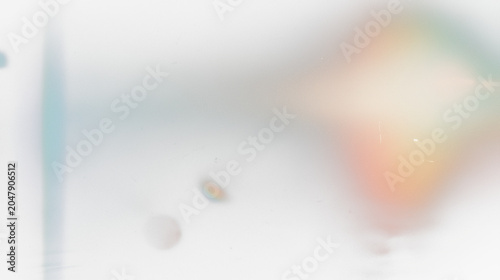 light leak effect with vintage film grain texture and colorful lens flare abstract background