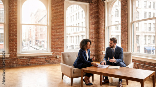 Manager Coaching Employee During Professional Development Meeting