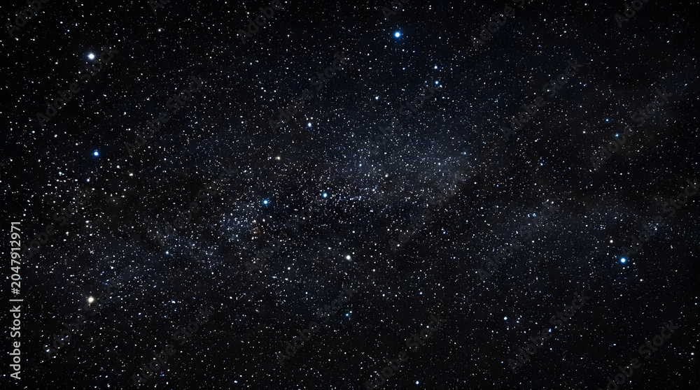 Fototapeta premium Holiday illumination and decoration concept background with stunning starry night sky
