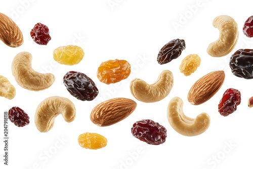 Variety of healthy nut and dried fruit mix flying with cranberries floating isolated