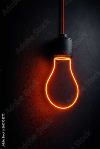 A minimalist close-up shot of an orange neon lightbulb outline viewed from a side perspective against a dark, textured background. The neon glow contrasts sharply with the darkness, creating a sleek a