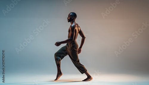 Graceful Male Dancer in Motion Against a Gradient Background.