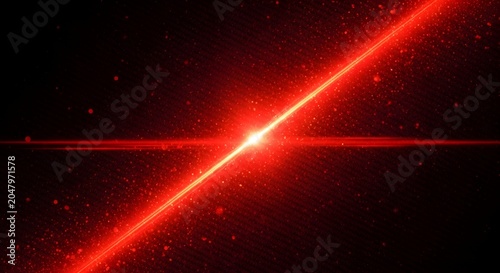 Dynamic red laser beam with sparkling particles on a dark black background