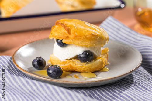Scone Filled with Blueberry  and Clotted Cream on a plate