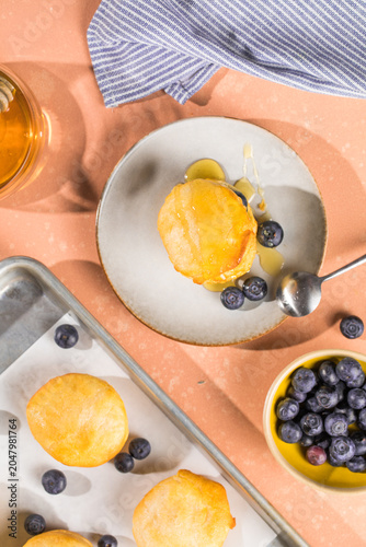 Scone Filled with Blueberry  and Clotted Cream on a plate
