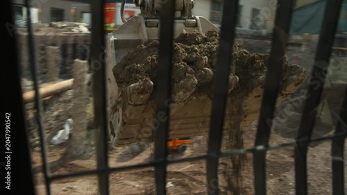 View from Excavator Cab During Earthmoving Operations at Construction Site