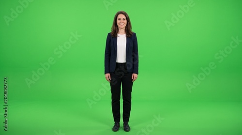 Full Length Businesswoman Standing on Green Screen Background for Chroma Key Video Production