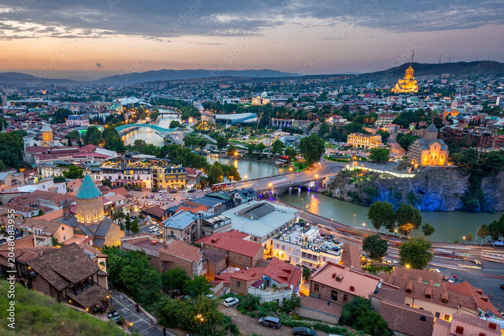 Fototapeta premium Western Asia, South Caucasus, Republic of Georgia, Tbilisi. City overview, skyline. Sunset.