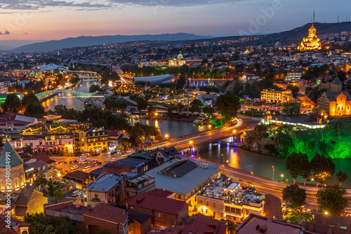 Western Asia, South Caucasus, Republic of Georgia, Tbilisi. City overview, skyline. Sunset.