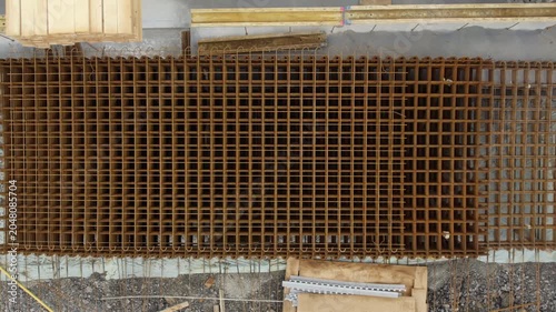 Top-Down View of Stacked Reinforcement Mesh Panels at Construction Site