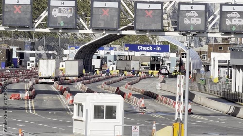 Commercial trucks waiting at border station 4K