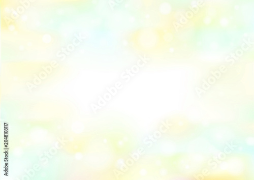 黄色と緑の美しい木漏れ日背景。初夏の新緑や太陽の光を感じる幻想的な壁紙。金運や開運スピリチュアルヒーリング枠。
