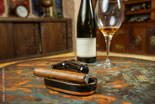 Premium Cigar with Wine Glass and Accessories on Rustic Table