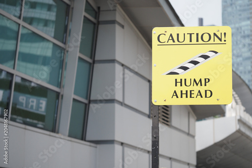 Canvas Print Caution sign showing hump ahead in urban area