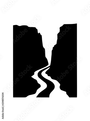 Black and White Silhouette of a Winding Road Through a Mountain Canyon