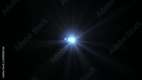 Optical flare with light rays on black background alpha chenel. shine light lens flares flickering animation overlays. white light star burst, abstract glow lens flare background.4 k animation video.