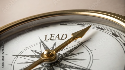 Close-up of a classic compass with the word 'LEAD' prominently displayed on the face, symbolizing guidance and direction in personal growth